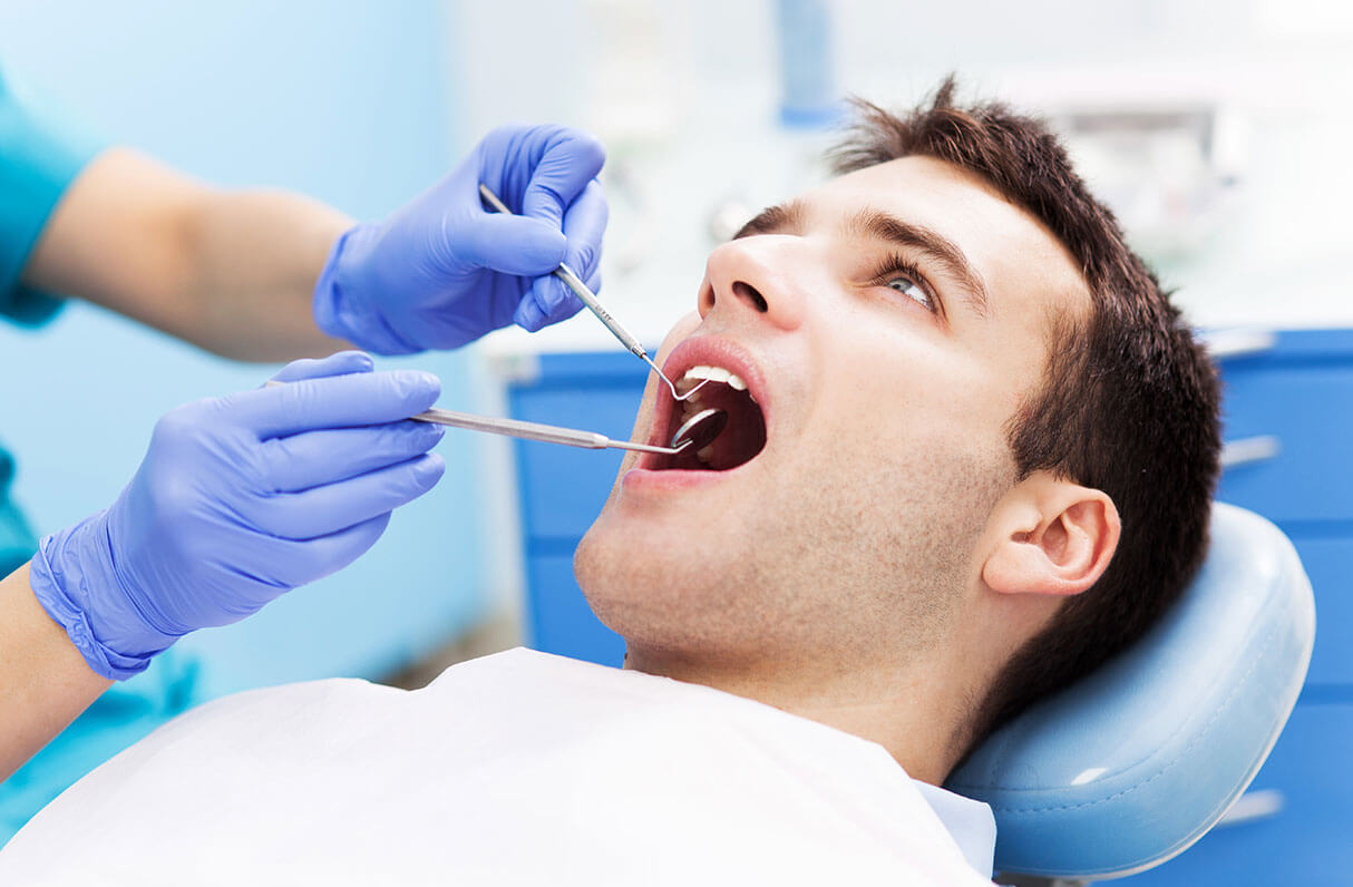 dentist examining a patient's teeth