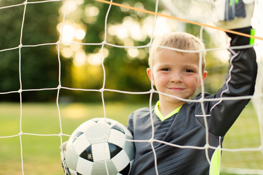 Boy wearing a custom sports mouthguard in Portland, OR