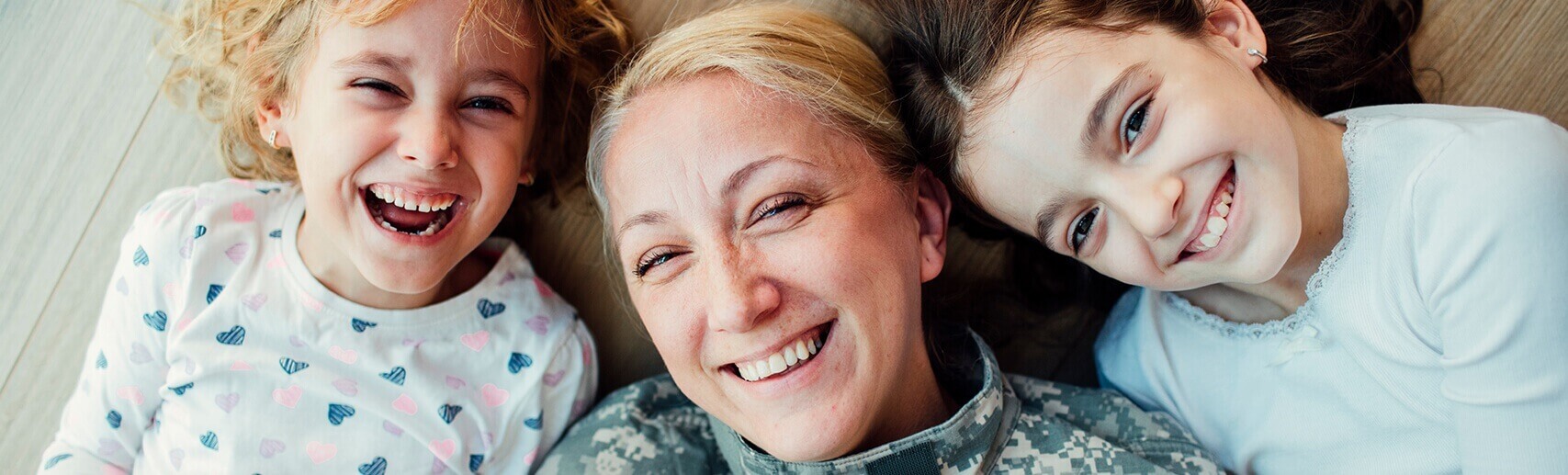 woman and two children smiling