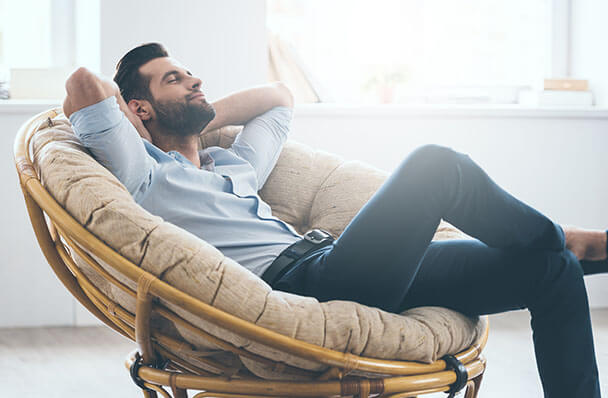 a man relaxing in a chair