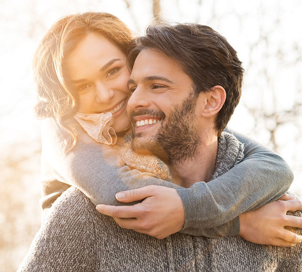 woman hugging man from behind