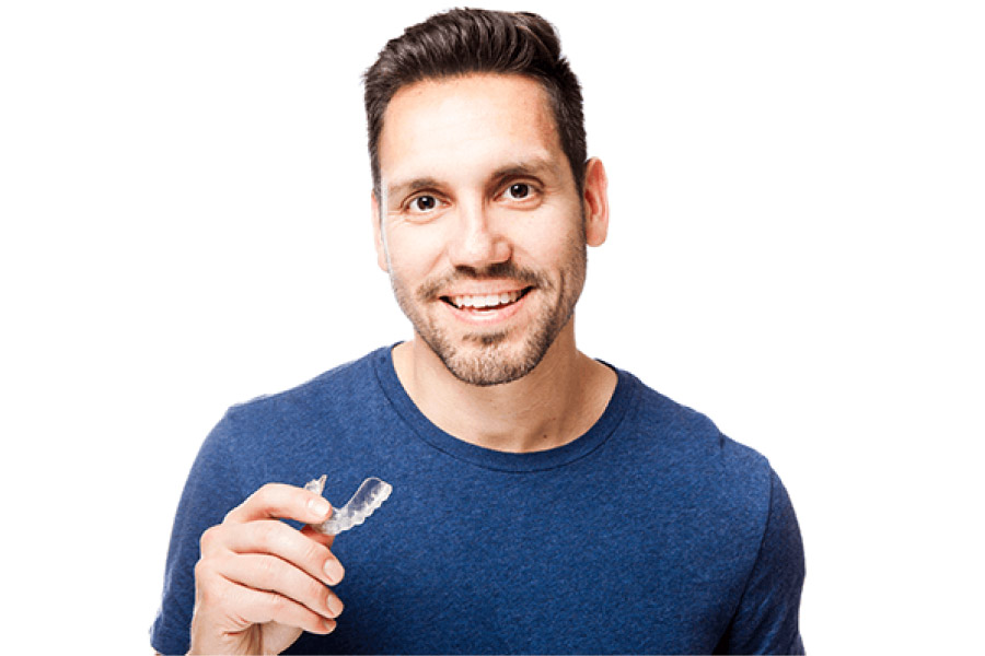 man holds his suresmile clear aligner