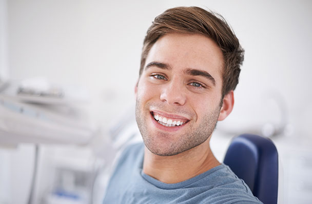 a young man getting a dental exam